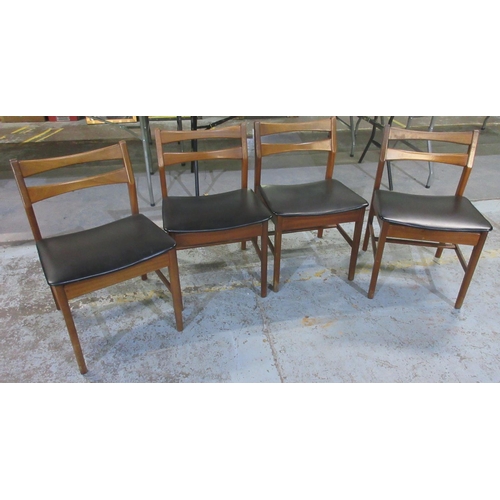 632 - Set of four mid-century teak dining chairs, black upholstered seats on tapered supports, (4)