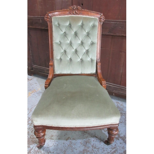 635 - Victorian oak framed nursing chair, buttoned back and serpentine seat on turned supports with brass ... 