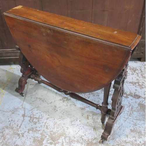 636 - Victorian mahogany Sutherland table, two d shaped leaves on pierced end supports with brass sockets ... 