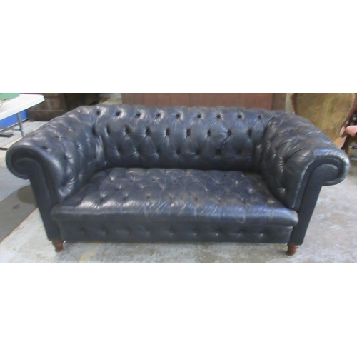 638 - Victorian Chesterfield sofa, later reupholstered in buttoned blue leather, on turned supports, W190c... 