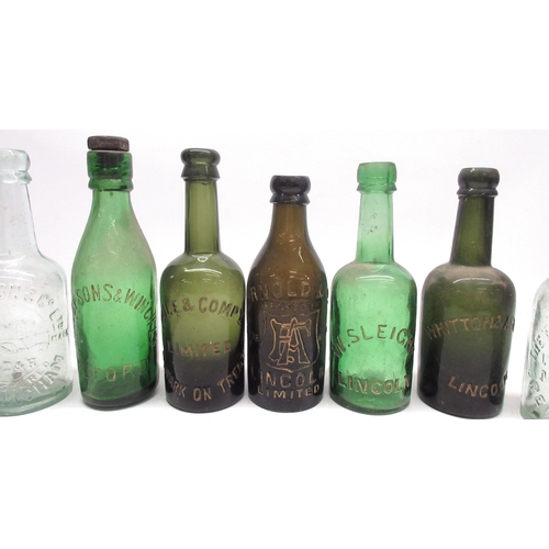 232 - Collection of eighteen early 20th century glass bottles with various makers incl, Schweppes, Ellman'... 