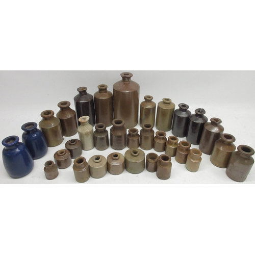 243 - Large collection of stoneware ink jars and inkwells