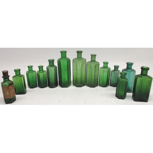 250 - Collection of green glass poison bottles of varying sizes, some with glass ribbing and others with c... 