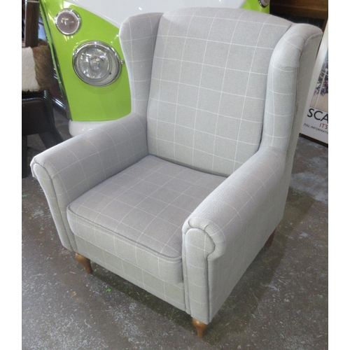 646 - Contemporary wing back arm chair, upholstered in grey check, with loose seat cushion on turned suppo... 