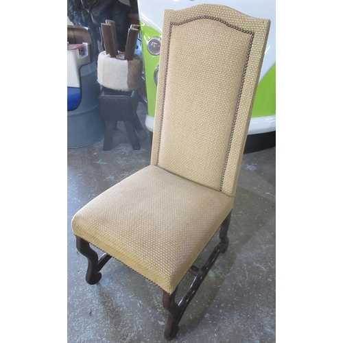 647 - 17th century style arched back chair, brass nail upholstered in mustard check, on curved supports an... 