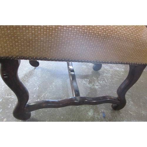 647 - 17th century style arched back chair, brass nail upholstered in mustard check, on curved supports an... 