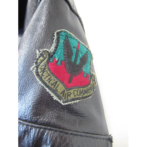 1353 - Leather bomber jacket (L) with Tactical Air Command patch to right sleeve and U.S. Army 507th Parach... 