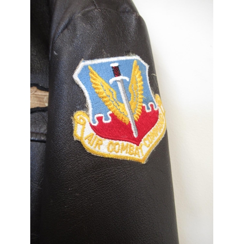 1354 - Leather bomber jacket (XL) with Air Combat Command patch to left arm, U.S. Air Force badge to left s... 