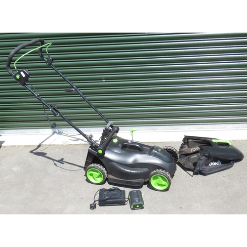 1289 - Gtech electric lawn mower with battery , charger and grass collection box