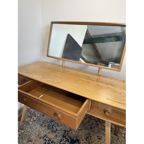 550 - Ercol Windsor dressing table, rectangular top mounted by rectangular mirror, three drawers, on taper... 