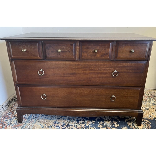 554 - Stag Minstrel low chest, fitted with four short over two long drawers, H72cm W107cm D46cm