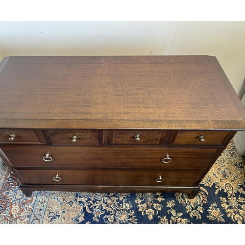 554 - Stag Minstrel low chest, fitted with four short over two long drawers, H72cm W107cm D46cm