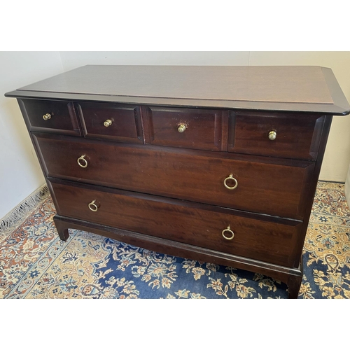 595 - Stag Minstrel low chest, fitted with four short over two long drawers, H72cm W107cm D46cm