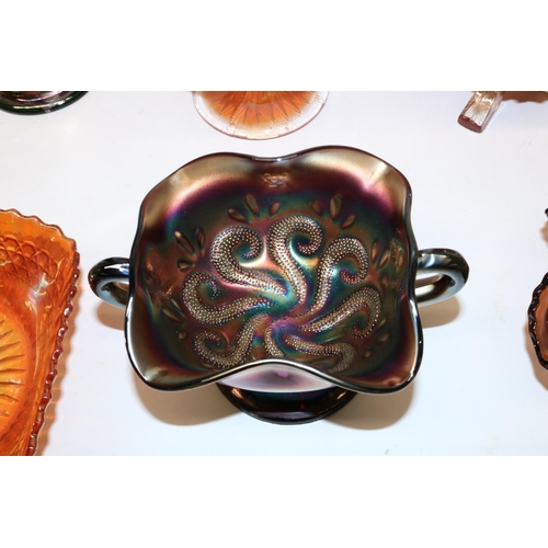 804 - Various iridescent marigold and amethyst carnival glass items, incl. a Dugan 'Question Marks' footed... 