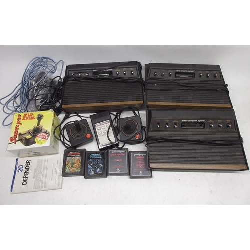 1052 - Three Atari CX2600 computer systems with three joystick's, star raiders touch pad and four games car... 