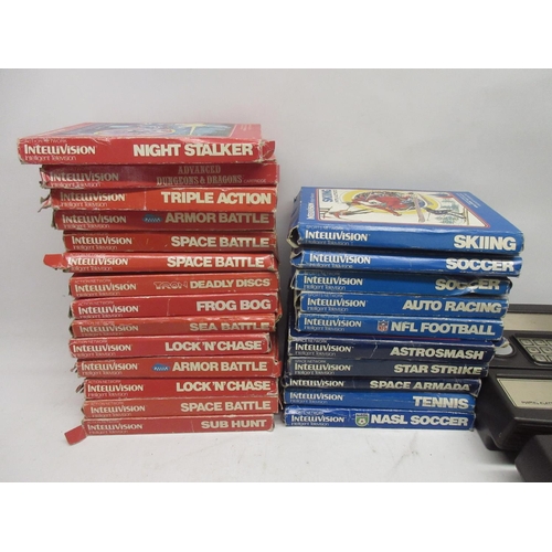 1055 - Four Mattel IntelliVision games consoles, with twenty-four boxed games incl night stalker, space arm... 