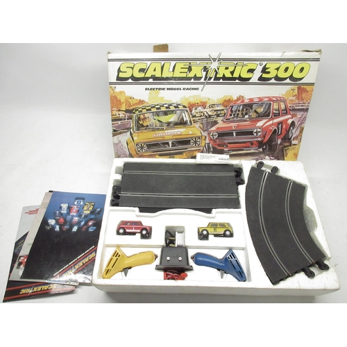 1058 - Scalextric 300 set with two cars, Formula 1 slot racing car C137 Ligier JS11, UOP Shadow car, other ... 