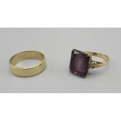 13 - 14ct yellow gold ring set with purple stone, stamped 14K, N1/2, and a plain 9ct yellow gold band rin... 