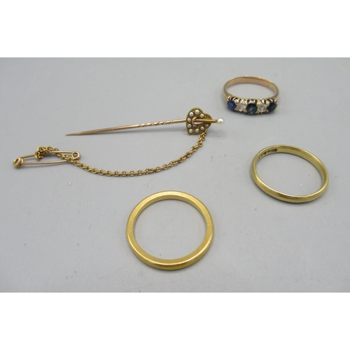 18 - Two yellow metal rings with worn hallmarks, 5.2g, a yellow metal ring set with clear and blue stones... 