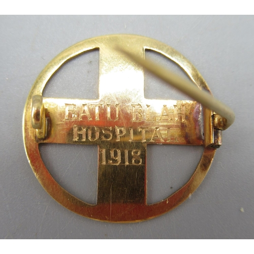 20 - Yellow metal hospital pin badge, the back engraved 'Batu Blah Hospital 1918', not hallmarked, and an... 