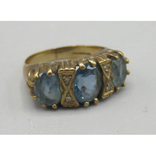 671 - 9ct yellow gold ring set with three large blue stones and diamonds, stamped 375, 4.5g