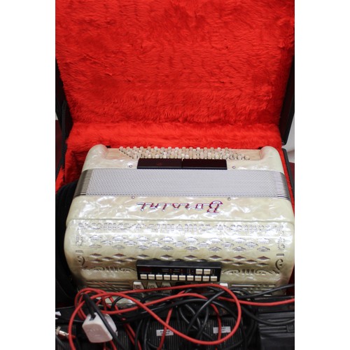 854 - Early 1970's Borsini piano accordion in cream marbleized acrylic case, simulated black and white mot... 