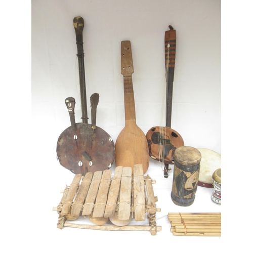 414 - Mixed collection of Tribal/Indigenous musical instruments to inc. Xylophones, string instruments, wi... 