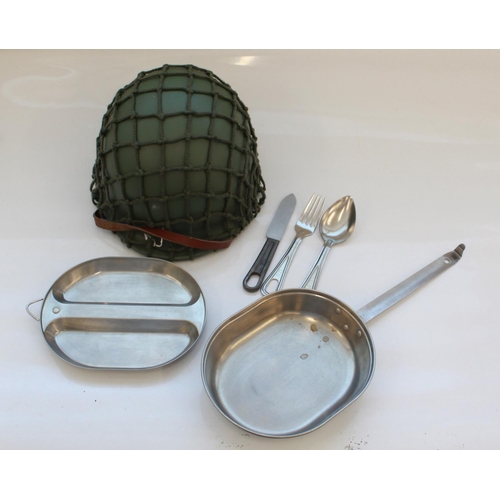 1392 - As new U.S. M1 helmet with camouflage net. U.S. mess kit with spoon, fork, knife. Knife dated 1942