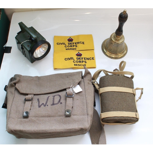 1398 - Military style nap sack, WWII water bottle with carry strap, two civil defence corps arm bands, ward... 