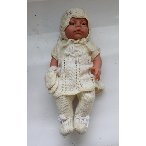 1400 - WWII Babies Gas mask. Complete, with working pump. Peterkin doll in knitted outfit