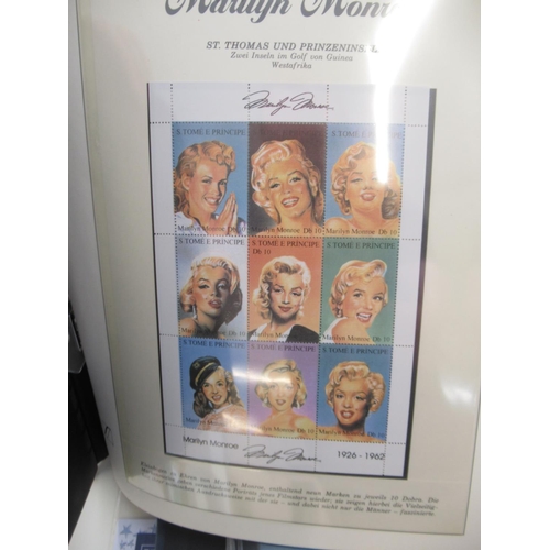 647 - Collection of Marilyn Monroe and Elvis Presley related stamps and covers in 4 folders