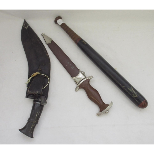 1413 - Selection of militaria, including a horn-handled Kukri, an early police truncheon, a bugle etc.