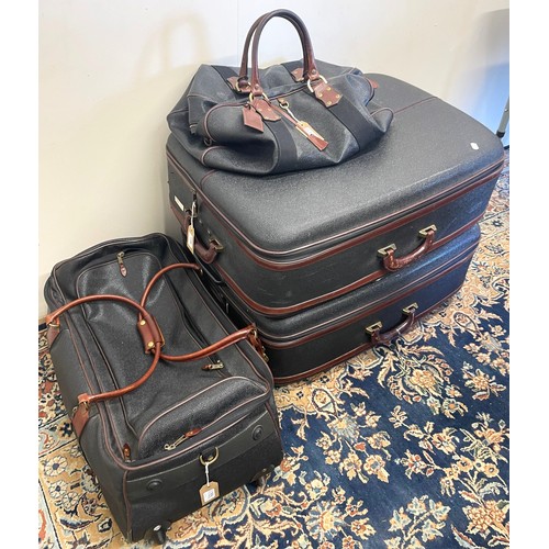 Mulberry luggage set to include holdall duffle bag and two suitcases in black leather with brown l