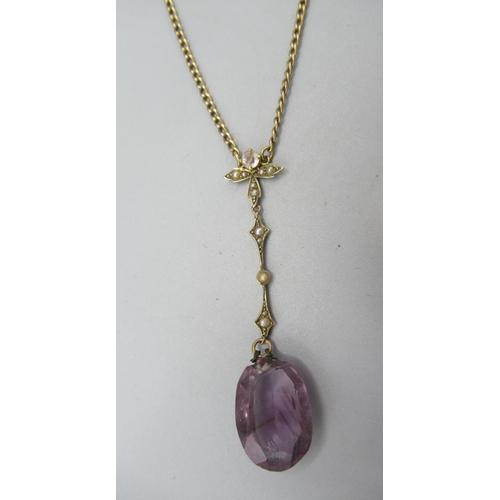 35 - 9ct yellow gold pendant set with large purple stone and seed pearls, on yellow metal chain, a yellow... 