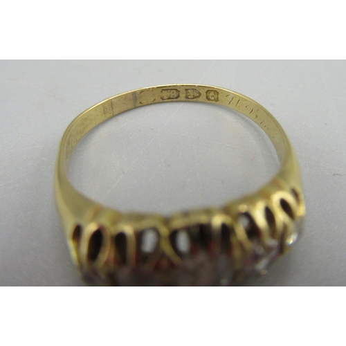 44 - 18ct gold ring set with five diamonds, stamped 18, size L1/2, 2.7g