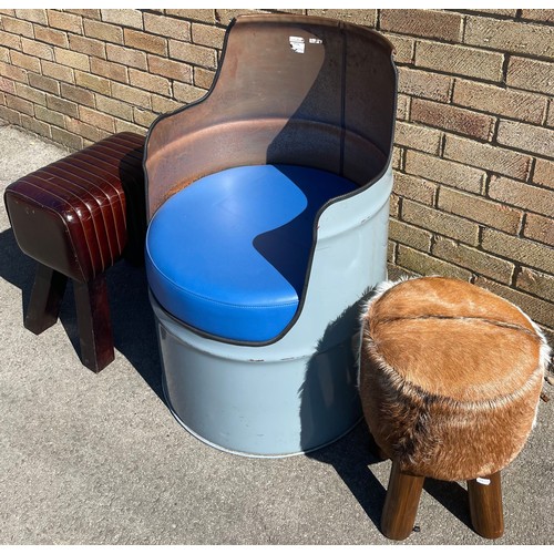 1199 - Shane Lynch collection - Industrial tub chair, leather foot stool and a cow hide foot stool