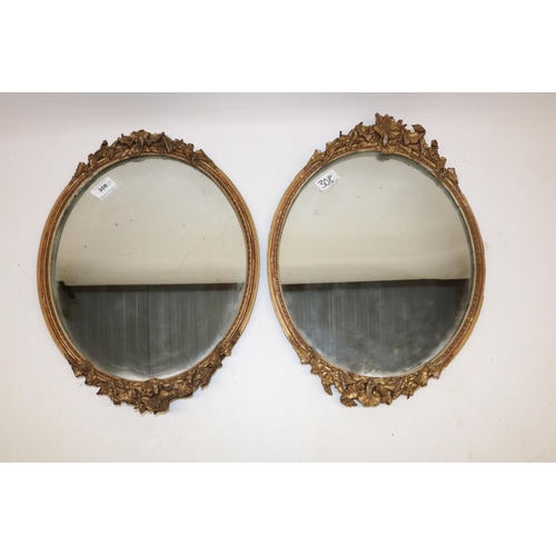 308 - Pair of late 19th century gilt gesso framed oval mirrors, H44cm (2)