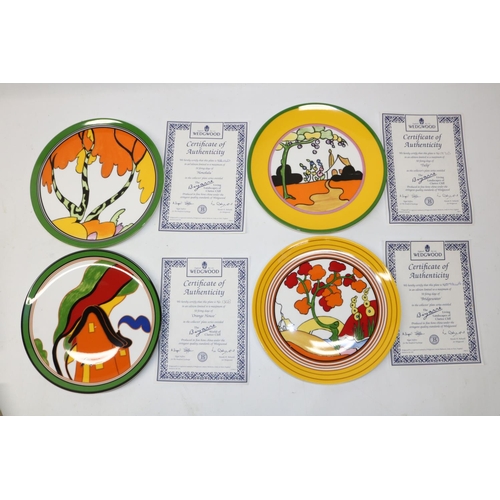 714 - Four Wedgwood Clarice Cliff Bradford Exchange wall plates, patterns comprising 'Bridge Water', 'Oran... 