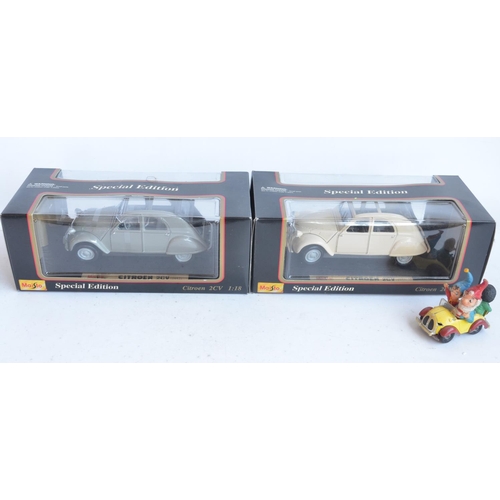 355 - Two 1/18 scale diecast special edition 1952 Citroen 2CV models from Maisto (both models in at least ... 