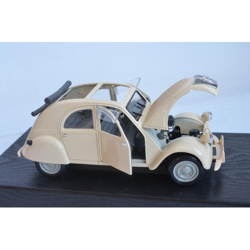 355 - Two 1/18 scale diecast special edition 1952 Citroen 2CV models from Maisto (both models in at least ... 