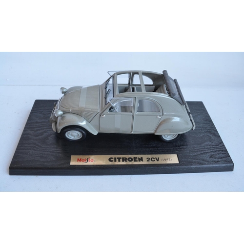 355 - Two 1/18 scale diecast special edition 1952 Citroen 2CV models from Maisto (both models in at least ... 