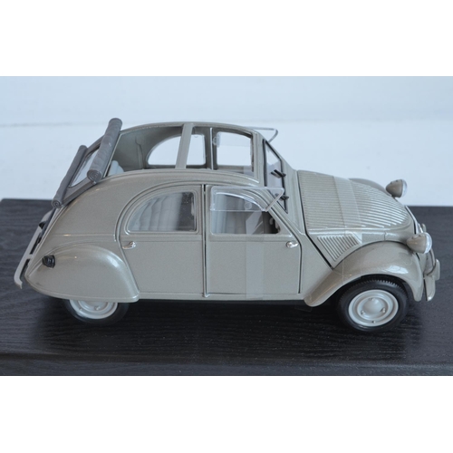 355 - Two 1/18 scale diecast special edition 1952 Citroen 2CV models from Maisto (both models in at least ... 