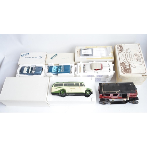 363 - Four boxed 1/24th scale diecast vehicles to include a Franklin Mint 1953 Cadillac Eldorado (model wi... 