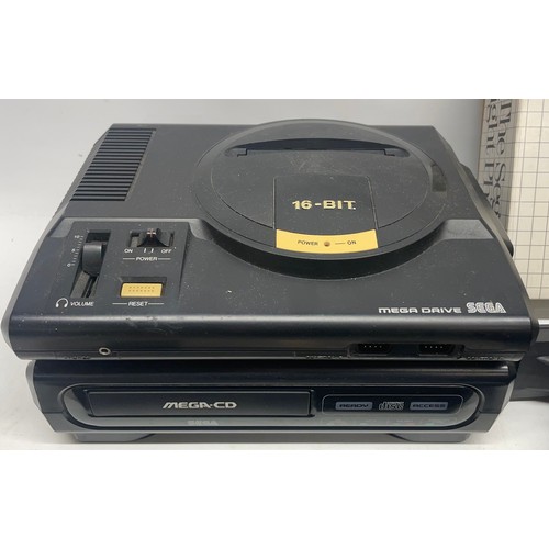 1057 - Sega Mega-CD and Mega drive console set, with four controllers, saitek joystick, Sega light phaser a... 