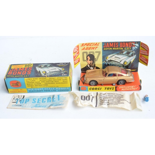 382 - Vintage boxed Corgi 261 James Bond gold coloured Aston Martin DB5, model in good overall condition, ... 