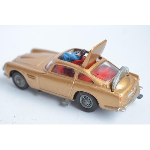 382 - Vintage boxed Corgi 261 James Bond gold coloured Aston Martin DB5, model in good overall condition, ... 