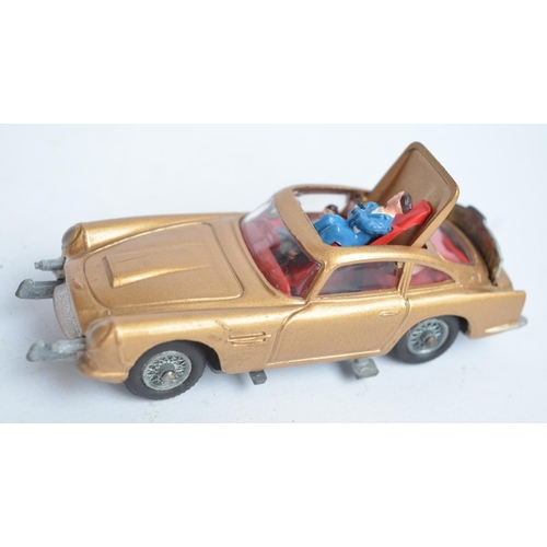 382 - Vintage boxed Corgi 261 James Bond gold coloured Aston Martin DB5, model in good overall condition, ... 