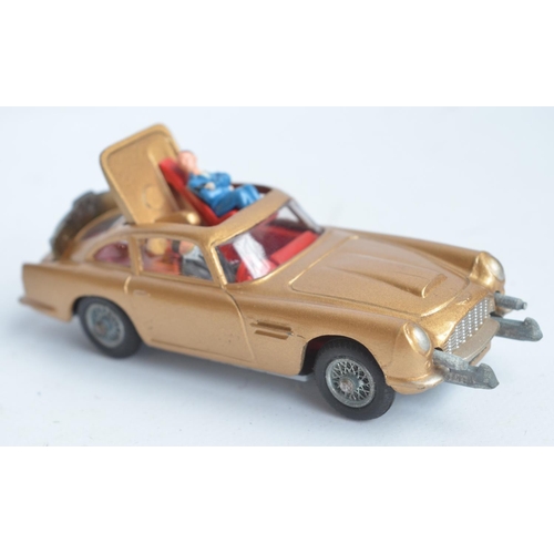 382 - Vintage boxed Corgi 261 James Bond gold coloured Aston Martin DB5, model in good overall condition, ... 