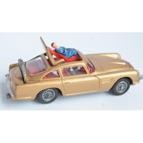 382 - Vintage boxed Corgi 261 James Bond gold coloured Aston Martin DB5, model in good overall condition, ... 