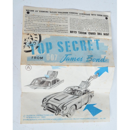 382 - Vintage boxed Corgi 261 James Bond gold coloured Aston Martin DB5, model in good overall condition, ... 